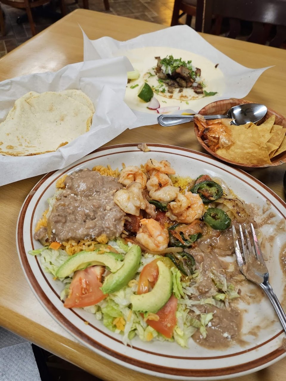 Mexican dishes, including tacos and birria